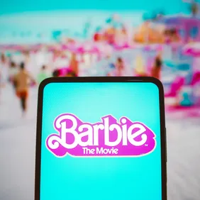 In this photo illustration, the Barbie the movie logo seen