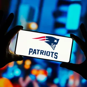 In this photo illustration, the New England Patriots logo is
