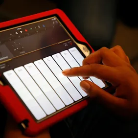 A student uses the GarageBand application on a iPad to make music during a "Girls On The Mic" class at the Women's Audio Mission studio on Thursday, Sept. 14, 2017, in Oakland, Calif.  Women's Audio Mission is a San Francisco-based non-profit whose missio