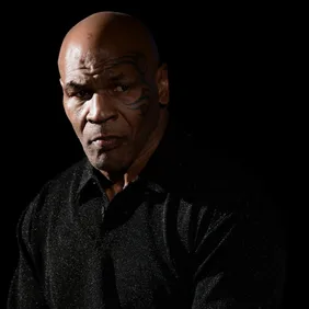 Mike Tyson, American former professional boxer, looks on