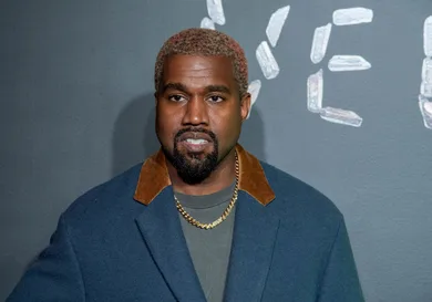 : Kanye West attends the the Versace fall 2019 fashion show at the American Stock Exchange Building in lower Manhattan on December 02, 2018 in New York City