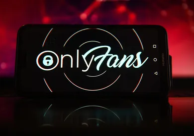 In this photo illustration the OnlyFans logo seen displayed