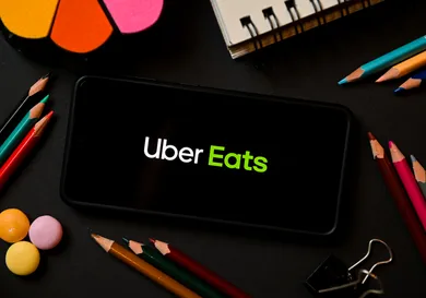 In this photo illustration a Uber Eats logo seen displayed