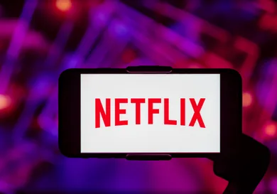 In this photo illustration, the Netflix logo is seen