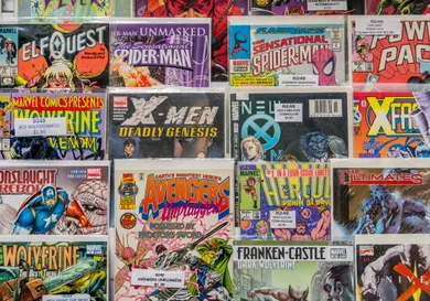 Rack of comic books for sale at a flea market