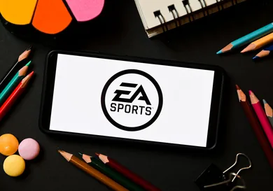 In this photo illustration a EA Sports logo seen displayed