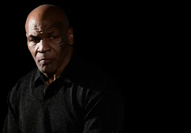 Mike Tyson, American former professional boxer, looks on