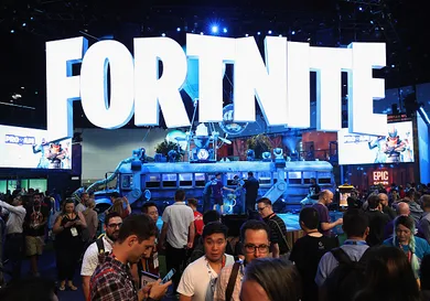 Game enthusiasts and industry personnel visit the 'Fortnite' exhibit during the Electronic Entertainment Expo E3 at the Los Angeles Convention Center on June 12, 2018 in Los Angeles, California.