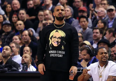Drake looks on from his courtside seat during the second half of an NBA game between the Golden State Warriors and the Toronto Raptors at Air Canada Centre on November 16, 2016 in Toronto, Canada.
